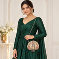 DEVIQ Surkh Shankh shell clutch — model wearing chain sling